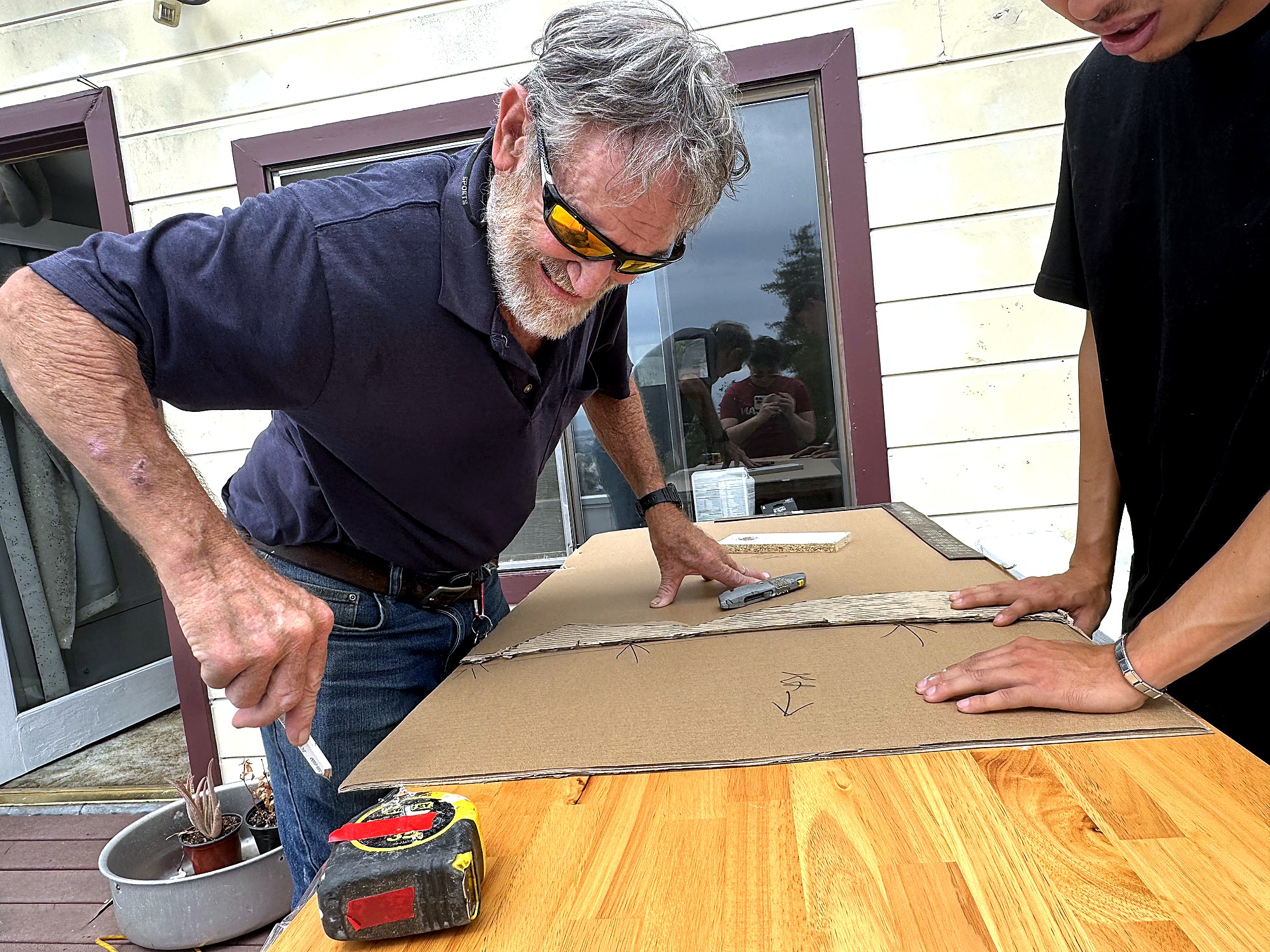 Hearney Construction crew laying out custom carpentry on-site